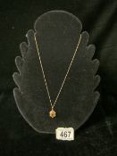 A 9 CARAT GOLD AND GEM SET NECKLACE, THE PENDANT INSET WITH STONES