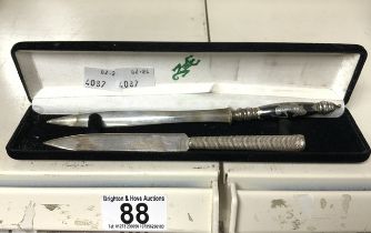 TWO CASED WHITE METAL HANDLED LETTER OPENERS, ONE MEXICAN SILVER