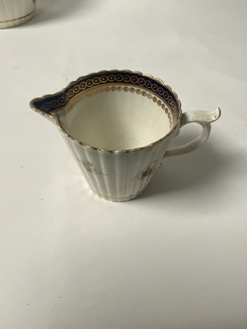18TH CENTURY ENGLISH PORCELAIN CIRCULAR RIBBED TEAPOT, WITH A SPARROWBEAK CREAM JUG, TWO CUPS AND - Image 7 of 13