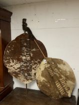 A ZULU HIDE SHIELD, THE OVAL CATTLE HIDE SHIELD WITH RECTANGULAR SLIT DECORATION TO THE FRONT WITH