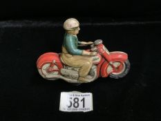 A VINTAGE SCHUCO CURVO 1000 MOTORBIKE WIND UP TOY, RED BIKE, GREEN AND BEIGE OVERALLS, LENGTH 12.