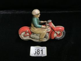 A VINTAGE SCHUCO CURVO 1000 MOTORBIKE WIND UP TOY, RED BIKE, GREEN AND BEIGE OVERALLS, LENGTH 12.