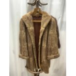 A MID-LENGTH BEIGE FUR COAT, FULLY LINED UK SIZE 10 WITH A LIGHT BROWN FUR WRAP BY A.BONTON FURRIERS