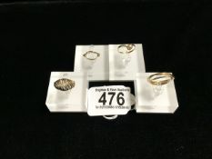 FOUR 9 CARAT GOLD RINGS; ONE LONDON 1987, OPENWORK SWIRL DECORATION, ONE LONDON 1977, MOUNTED WITH A