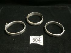 THREE HALLMARKED SILVER ENGRAVED HINGED BANGLES 57 GRAMS