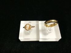 A 9 CARAT GOLD WEDDING BAND, LONDON 1977 AND A CAMEO RING, MARKS OBSCURED, TOTAL WEIGHT 4 GRAMS