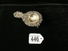 A DUTCH SILVER TEA STRAINER AND STAND, MARKED '830', FLORAL SCROLL OPENWORK BORDER, TERMINAL WITH