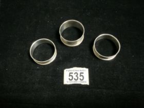 THREE HALLMARKED SILVER NAPKIN RINGS 31 GRAMS