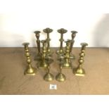 FIVE PAIRS OF BRASS CANDLESTICKS