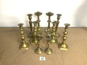 FIVE PAIRS OF BRASS CANDLESTICKS