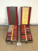 TWO METAL CASINGS OF NEGATIVES, INCLUDES 1930/40s GOLF, FISHING, NEW YORK 1941 OF PLACES AND MACYS