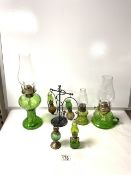 MIXED (MAINLY GREEN GLASS) OIL LAMPS; LARGEST 36CM