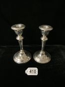 A PAIR OF STERLING SILVER CANDLESTICKS; MAKERS MARK RUBBED; BIRMINGHAM 1931; CIRCULAR FORM; HEIGHT