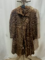 A MID-LENGTH BEIGE FUR COAT FULLY-LINED UK SIZE 14 WITH A DARK BROWN FUR CAPE