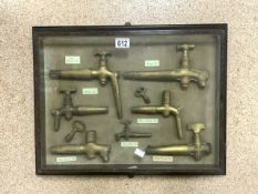 CASED ANTIQUE BRASS BOTTLING TAPS 57 X 45CM