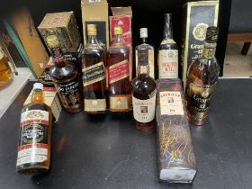EIGHT BOTTLES OF WHISKY: BALLANTINE; 50CL, GRANT'S; 12 YR OLD; 1 LITRE, SCOTCH KILT, SEAGRAMS 100