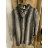 A GREY MID-LENGTH LINED FUR COAT, MADE IN ENGLAND LADIES SIZE 18