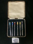 A CASED SET OF STERLING SILVER AND ENAMEL NOVELTY COCKTAIL STICKS BY ROBERTS & DORE; BIRMINGHAM
