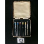 A CASED SET OF STERLING SILVER AND ENAMEL NOVELTY COCKTAIL STICKS BY ROBERTS & DORE; BIRMINGHAM