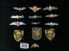 A QUANTITY OF METAL AND ENAMEL SOUTH AFRICAN PARACHUTE REGIMENT CAP BADGES AND LARGER BADGES