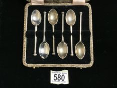 A CASED SET OF SIX STERLING SILVER TEASPOONS BY H. ATKINS; SHEFFIELD 1945; WITH KNOP FINIALS; LENGTH