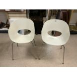 A PAIR OF ITALIAN SINTESI ORBIT LARGE MOULDED PLASTIC CHAIRS ON METAL LEGS