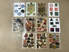 A QUANTITY OF MILITARY CLOTH BADGES AND SERGEANT STRIPES INCLUDING; UNITED NATIONS, CIVIL DEFENCE