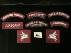 A QUANTITY OF PARACHUTE REGIMENT AND SPECIAL AIR SERVICE S.A.S (ARTISTS) CLOTH SHOULDER TITLES, ALSO