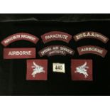 A QUANTITY OF PARACHUTE REGIMENT AND SPECIAL AIR SERVICE S.A.S (ARTISTS) CLOTH SHOULDER TITLES, ALSO