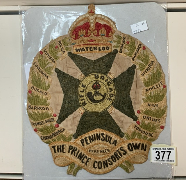 A LARGE MILITARY EMBROIDERED CLOTH BADGE; THE PRINCE CONSORTS OWN RIFLE BRIGADE