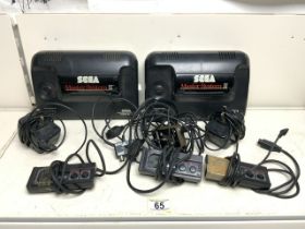 TWO SEGA MASTER SYSTEMS II WITH THREE CONTROLLERS A/F