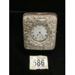 AN EDWARDIAN STERLING SILVER MOUNTED FOB WATCH HOLDER; BIRMINGHAM 1902; EMBOSSED SCROLL