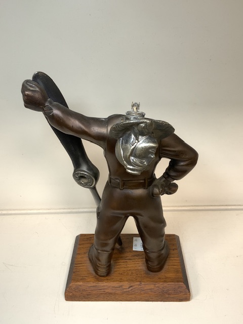 A VINTAGE NOVELTY TABLE LIGHTER MODELLED AS AN AIRMAN WITH PROPELLOR, ON WOODEN PLINTH; HEIGHT 27CM - Image 2 of 2