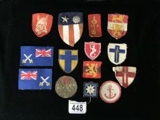 A QUANTITY OF MILITARY CLOTH BADGES, INCLUDING; US ARMY AIR FORCE, EAST ANGLIAN DISTRICT,