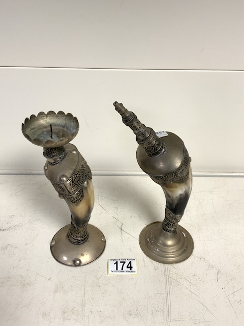 WHITE METAL AND HORN EASTERN CANDLESTICK WITH ONE OTHER; 25CM