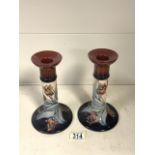 MOORCROFT; A PAIR OF 'TULIP' PATTERN COLUMN CANDLESTICKS DESIGNED BY SALLY TUFFIN; HEIGHT 21CM