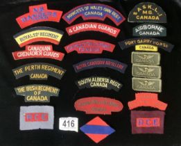 A QUANTITY OF CANADIAN MILITARY CLOTH SHOULDER TITLES, INCLUDING; REGINA RIFLE REGIMENT, SOUTH