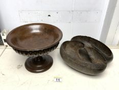 CARVED WOODEN PEDESTAL BOWL WITH A COCO DE MER BASKET; 24CM