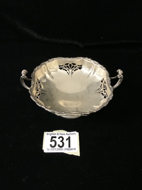 A STERLING SILVER TWO-HANDLED BON BON DISH; BIRMINGHAM 1951; PEDESTAL FORM, SCROLL BORDER AND