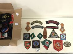 A LARGE QUANTITY OF MILITARY CLOTH BADGES AND SHOULDER TITLES, INCLUDING; ROYAL MARINES COMMANDO,