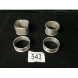 FOUR STERLING SILVER NAPKIN RINGS COMPRISING; A PAIR BY H. GRIFFITHS & SONS; BIRMINGHAM 1940/1, AN