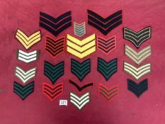 A QUANTITY OF MILITARY CLOTH TUNIC RANK CHEVRONS, VARIOUS COLOURS AND SIZES