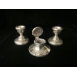 A PAIR OF STERLING SILVER DWARF CANDLESTICKS; BIRMINGHAM 1972 AND A SMALL STERLING SILVER CAPSTAN