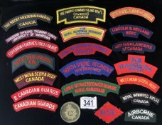 A QUANTITY OF CANADIAN MILITARY CLOTH BADGES INCLUDING; ROCKY MOUNTAIN RANGERS, QUEENS YORK RANGERS,