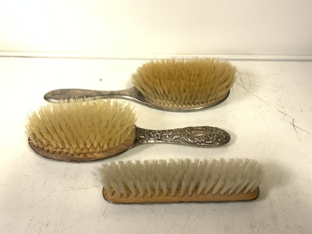 A STERLING SILVER MOUNTED HAIR BRUSH AND CLOTHES BRUSH; BIRMINGHAM 1961; EMBOSSED WITH CHERUBS, - Image 2 of 2