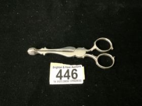 A PAIR OF ANTIQUE GEORGIAN STERLING SILVER SCISSOR ACTION SUGAR NIPS; MARKS RUBBED; SHELL GRIPS;