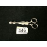 A PAIR OF ANTIQUE GEORGIAN STERLING SILVER SCISSOR ACTION SUGAR NIPS; MARKS RUBBED; SHELL GRIPS;