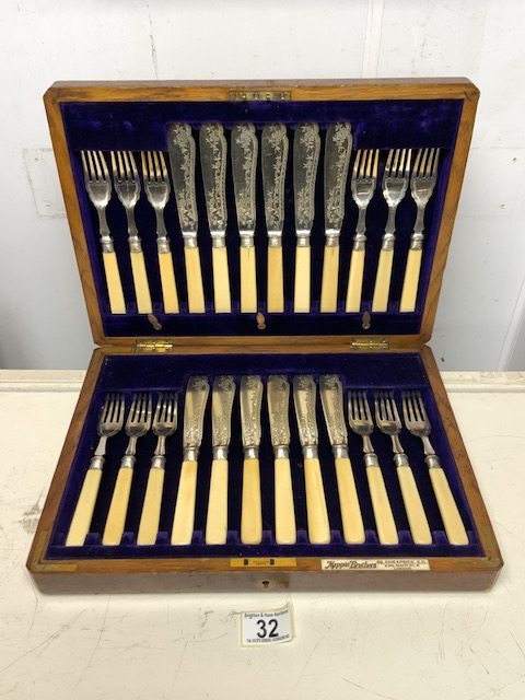 SET OF TWELVE PLATED AND ENGRAVED FISH KNIVES AND FORKS BY MAPPIN BROTHERS (WALNUT CASED)