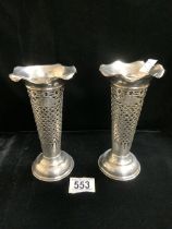 A PAIR OF EDWARDIAN STERLING SILVER VASES; CHESTER 1902; CONICAL FORM, OPENWORK DECORATION,