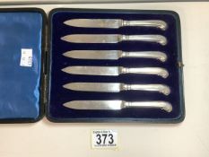 A CASED SET OF SIX STERLING SILVER HANDLED FRUIT / BUTTER KNIVES, BY H. ATKINS; SHEFFIELD 1913; WITH